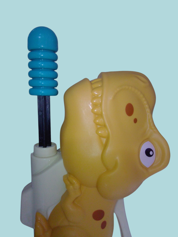 Pistola de agua figura de dinosaurio.