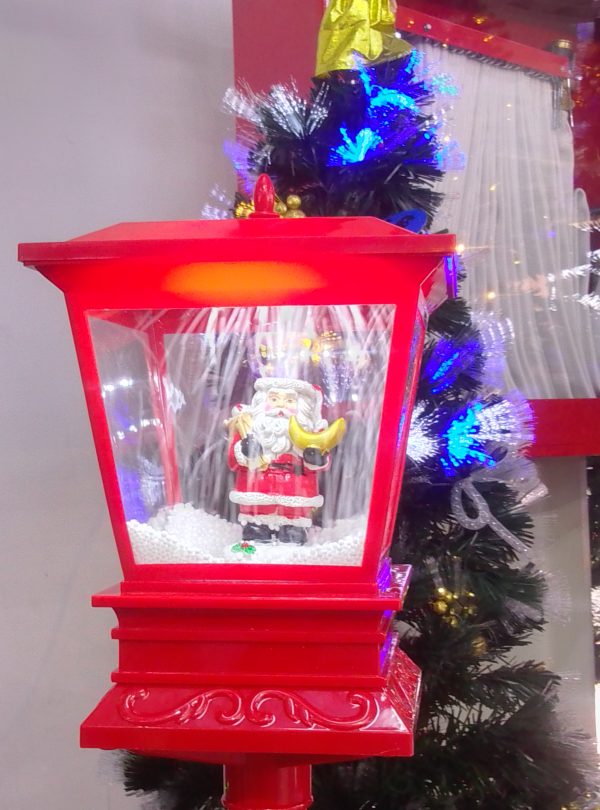 Farol de pedestal con santa Claus.